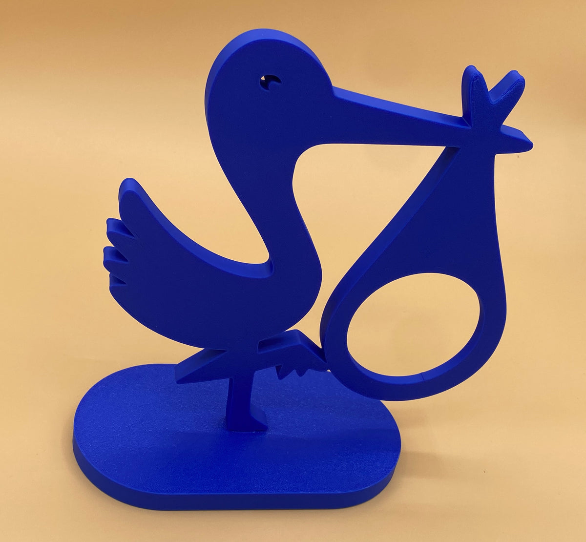 Blue stork photo holder showing the empty circular photo opening